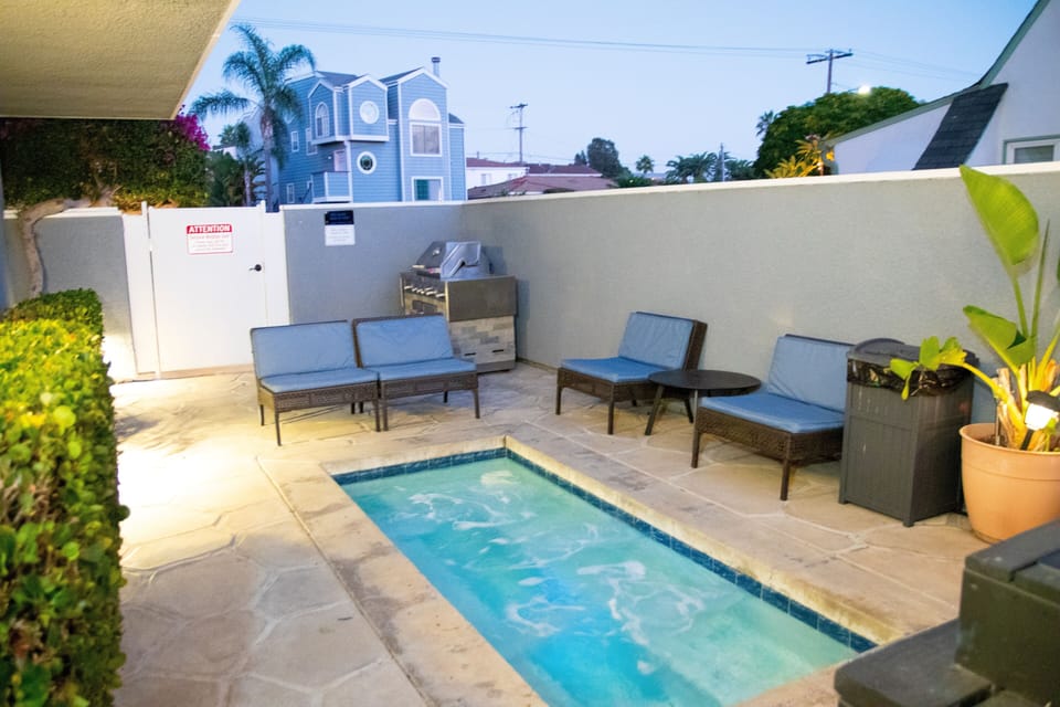 Relax in the 8 person spa after a long beach day