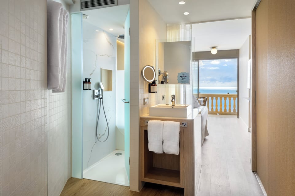 Shower, rainfall showerhead, eco-friendly toiletries, hair dryer