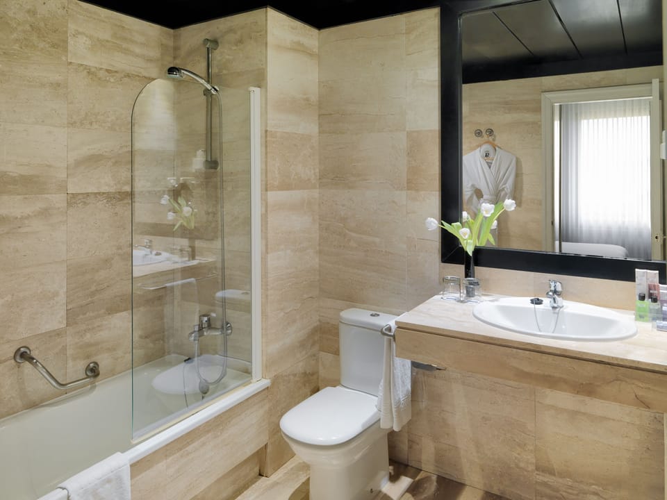 Designer toiletries, hair dryer, bathrobes, slippers