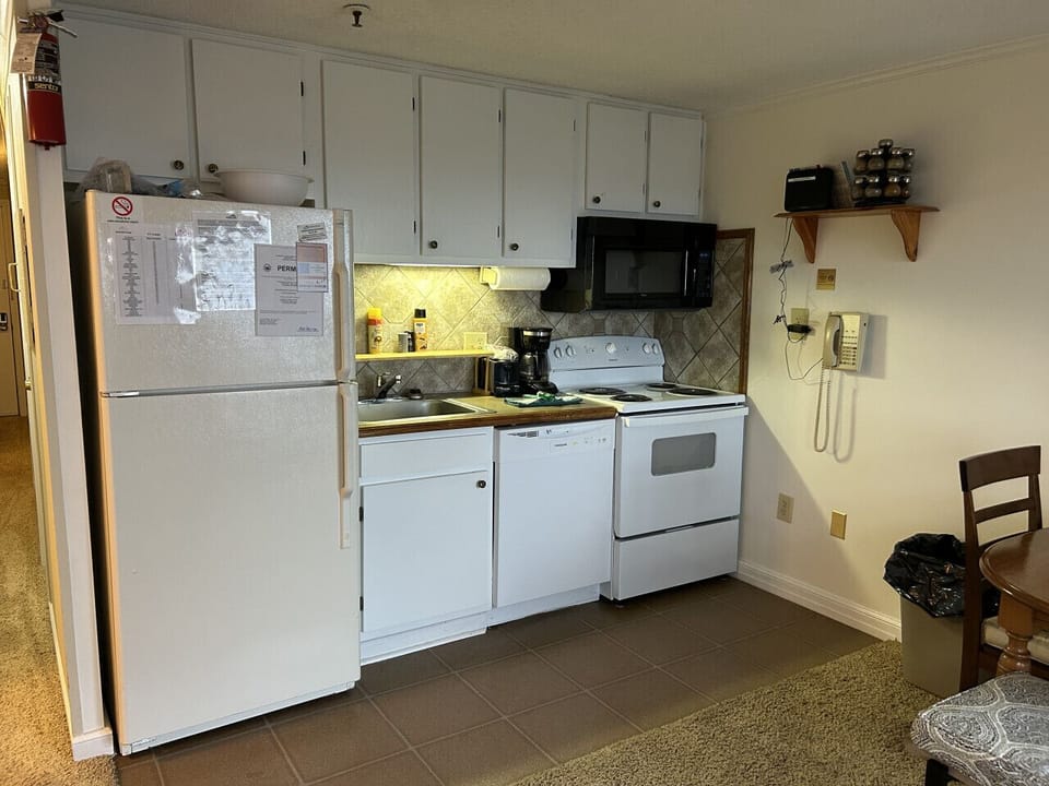 Kitchen is fully-equipped with pots, pans & utensils.