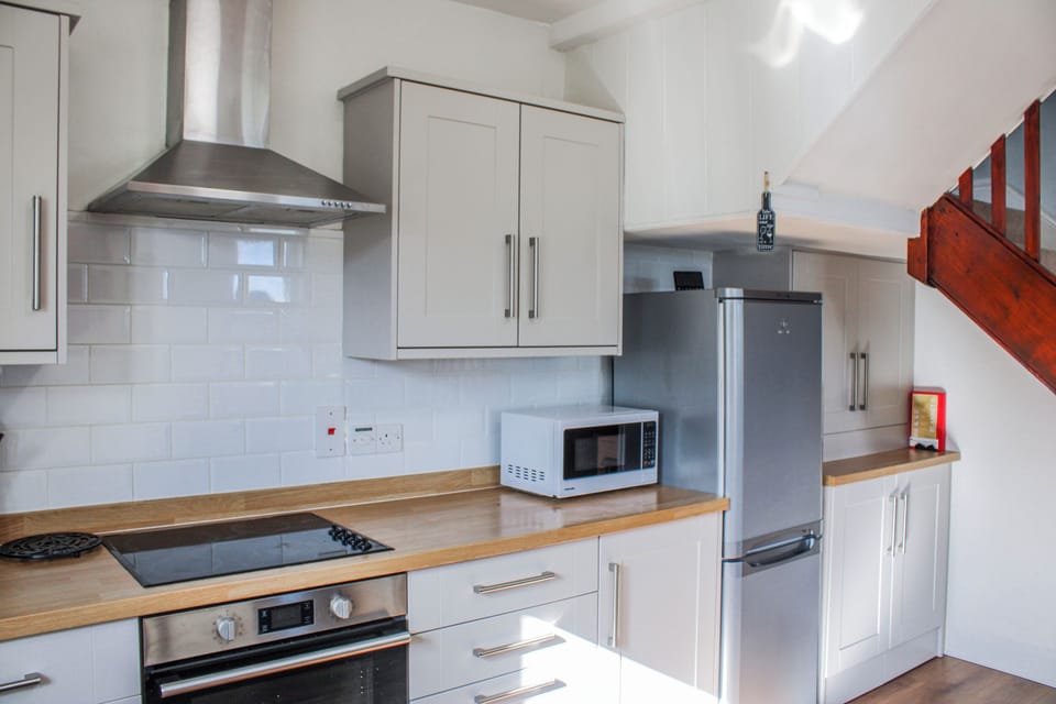 Fridge, dishwasher, electric kettle, cookware/dishes/utensils