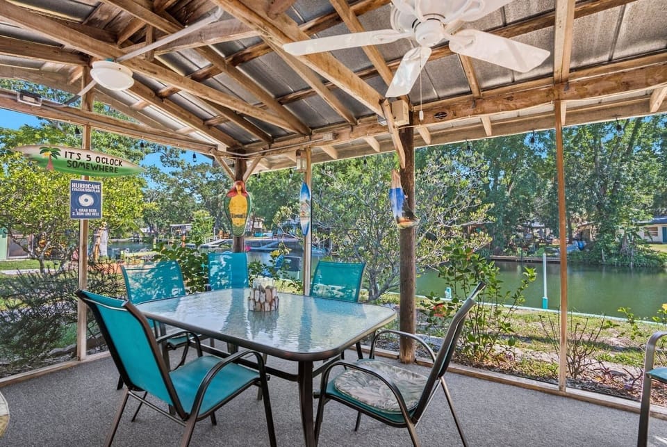 Our screened lanai offers plenty of space to relax, including an outdoor dining set, grill, fans, and porch swing.