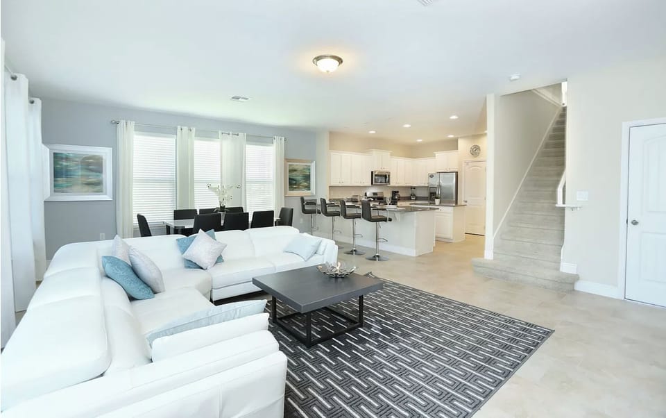 Light and bright open floor plan! Kitchen and den which walks out to the pool.