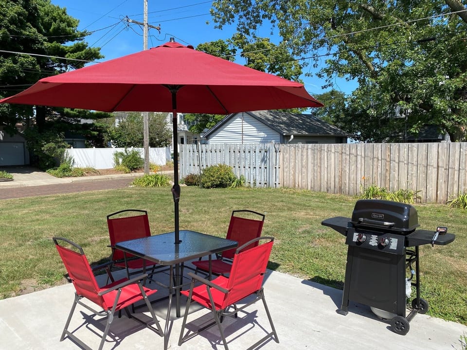 Enjoy the beautiful outdoors  complete with patio furniture and grill.