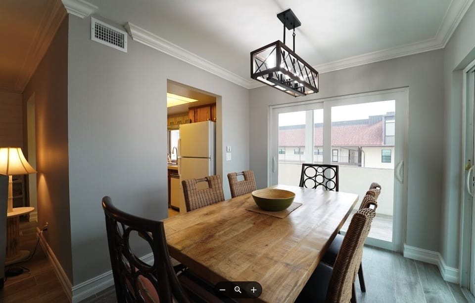 Dining area with new Table and chairs overlooking lanai.  