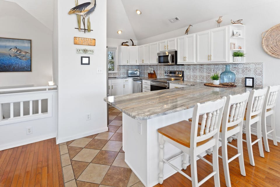 Enjoy a meal together at the dining table in the Dining Area, which can seat 8, or spread out and relax at the Breakfast Bar.