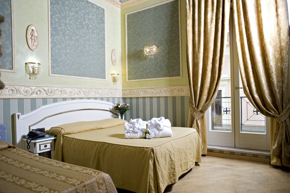 Deluxe Triple Room | In-room safe, desk, laptop workspace, blackout drapes