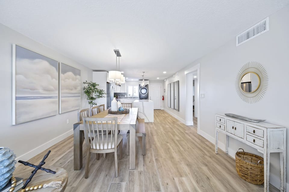 Bright and airy open layout with warm wood floors and natural light