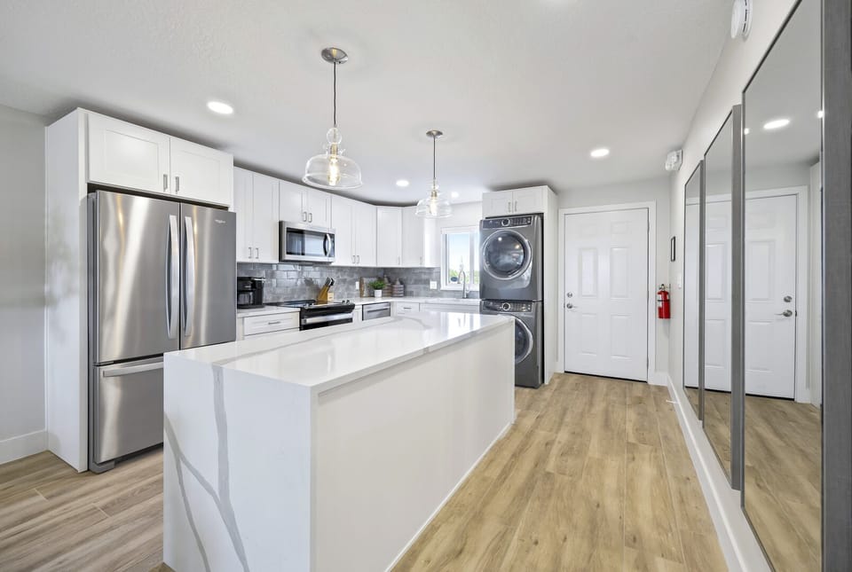 Sleek and spacious kitchen with all brand-new appliances and finishes