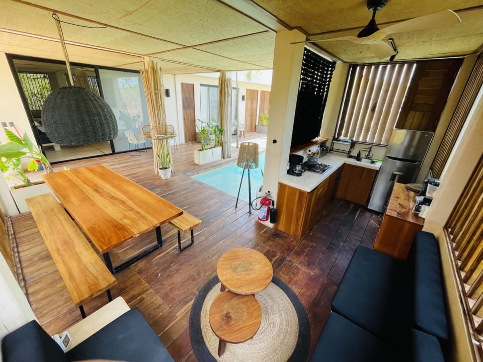 Open kitchen with large table by the pool