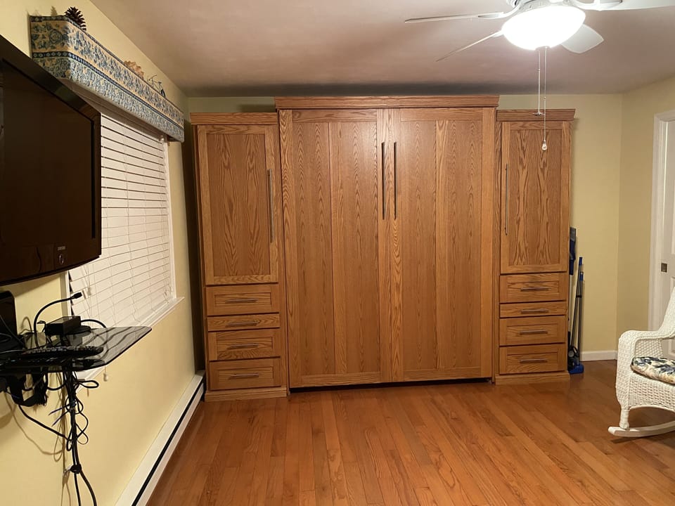 Murphy bed with hanging space and drawers on either side