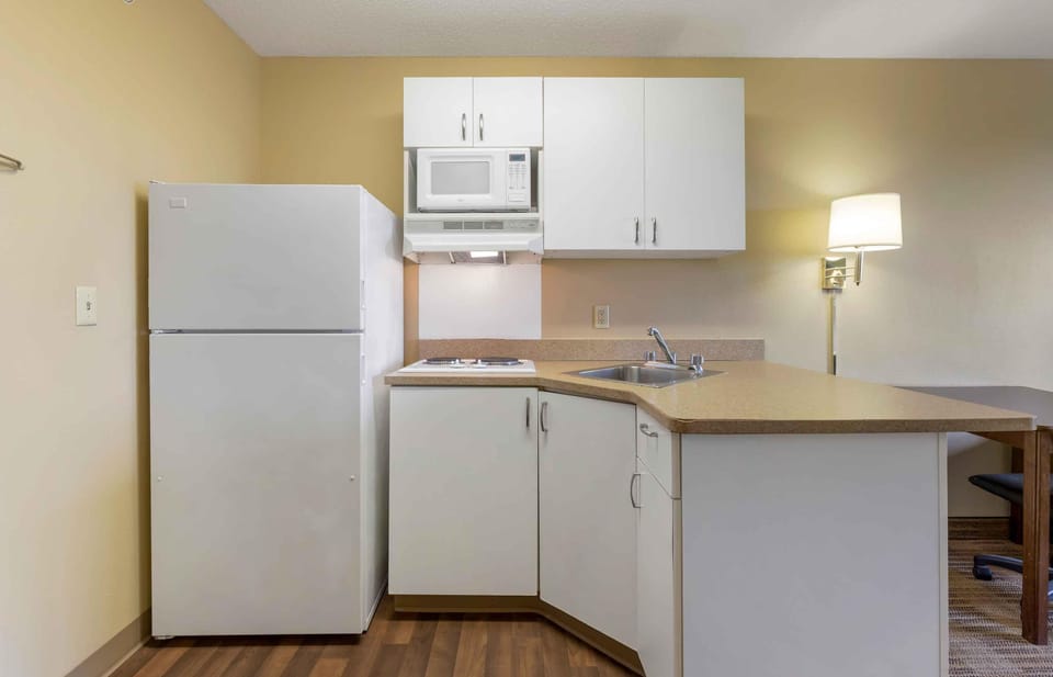 Studio, 1 Queen Bed, Non Smoking | Private kitchen | Coffee/tea maker, full-size fridge, microwave, stovetop