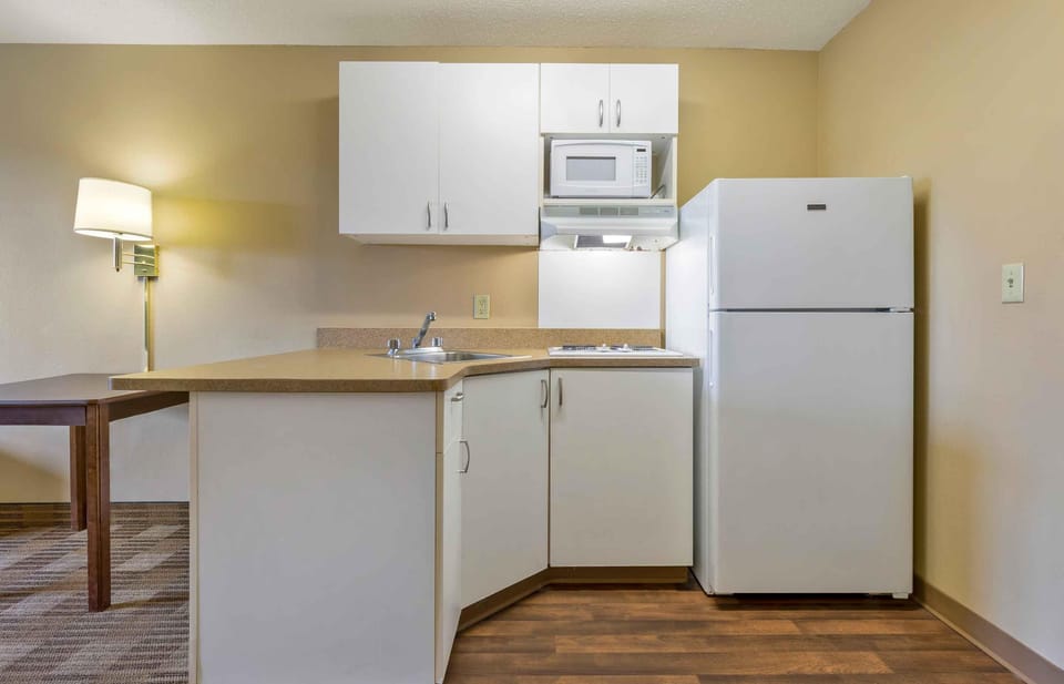 Studio, 1 King Bed, Non Smoking | Private kitchen | Coffee/tea maker, full-size fridge, microwave, stovetop