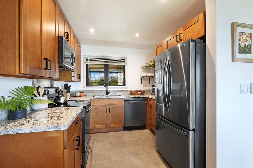 The fabulous new Kitchen with new counter tops, new cabinets, and new appliances