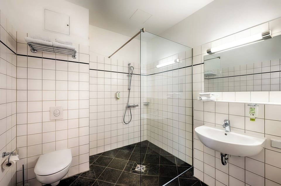 Standard Double Room | Bathroom | Shower, hair dryer, towels, soap