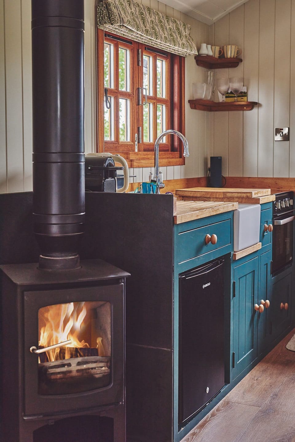 The kitchen and wood-burning stove at The Hangout Hut, Worcestershire