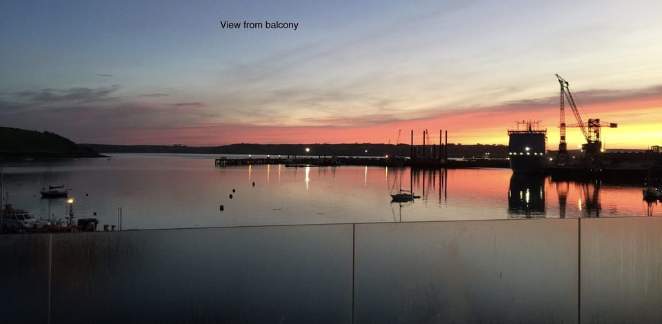 Sunrise across estuary from balcony