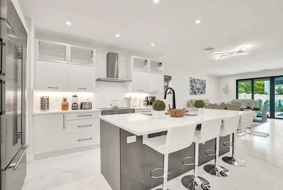 The modern, gourmet kitchen comes fully equipped with everything you could need