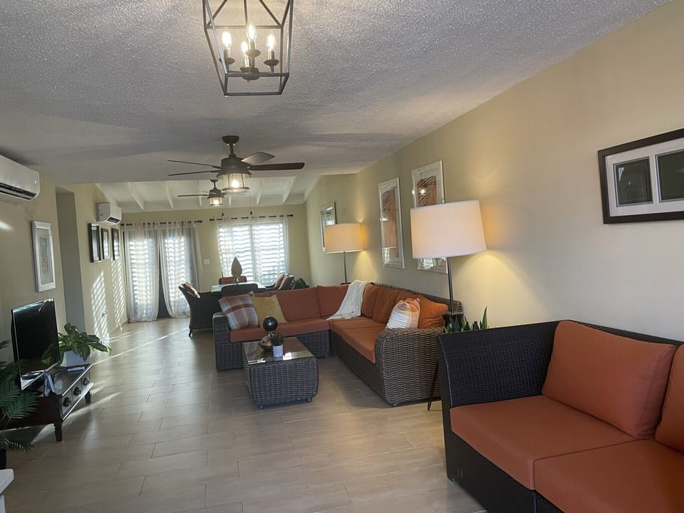 Step right in to a spacious living room with split a/c and smart TV