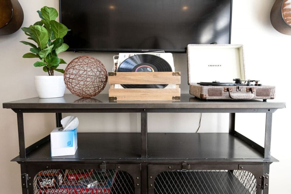 Smart TV in living room with Vinyl Record to listen to music