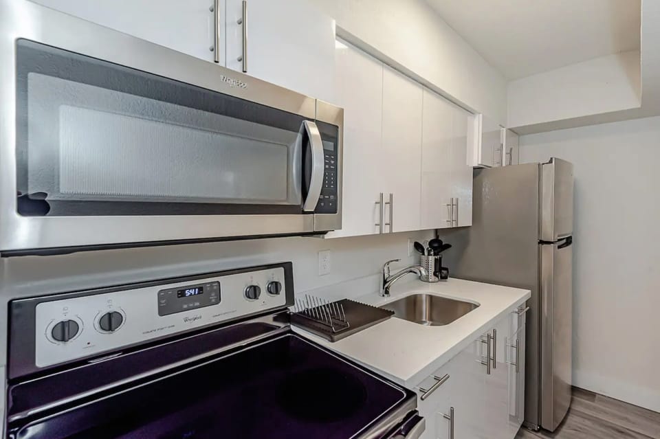 Featuring large kitchen sink and flat cook top