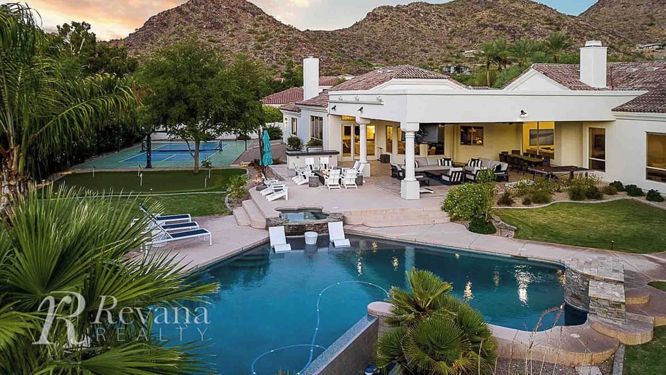 Large entertainment backyard w/ loungers, pool, spa, firepit, and games.