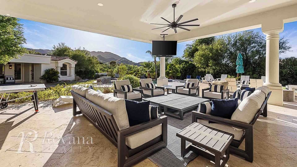 10 person outdoor lounge area under the covered patio w/ TV and mountain views.