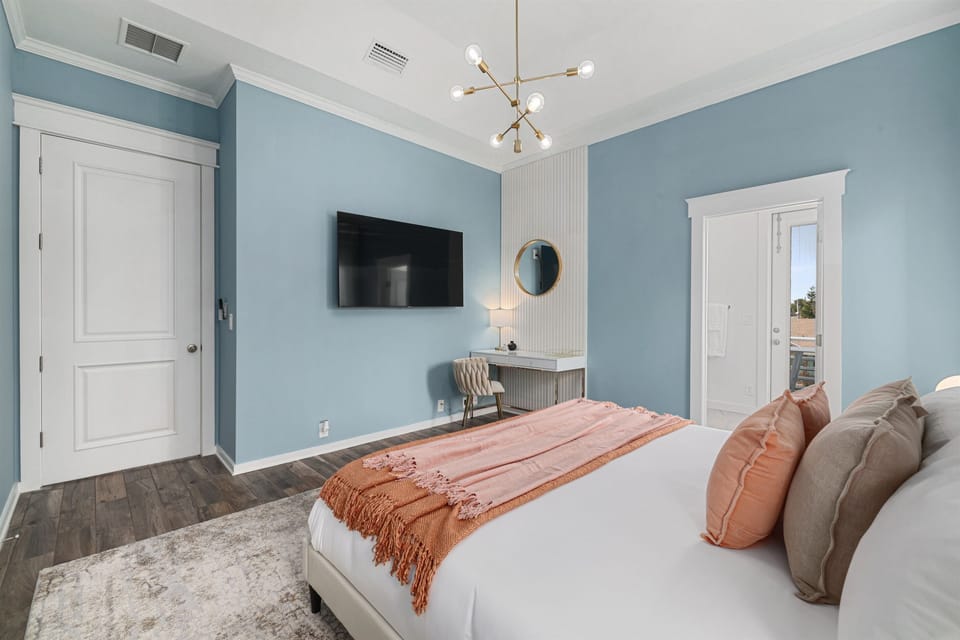 Guest bedroom #4 with king bed, smart TV, work space, and ensuite bathroom