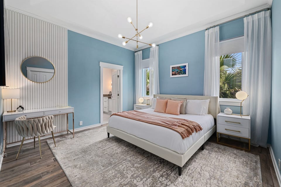 Guest bedroom #4 with king bed, smart TV, work space, and ensuite bathroom