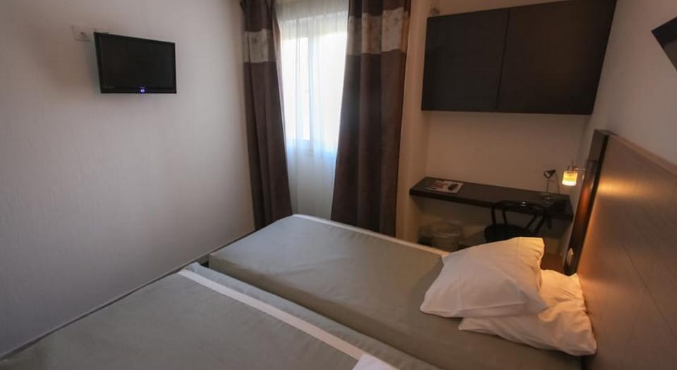Relax in your bedroom after a long day strolling around the city centre!