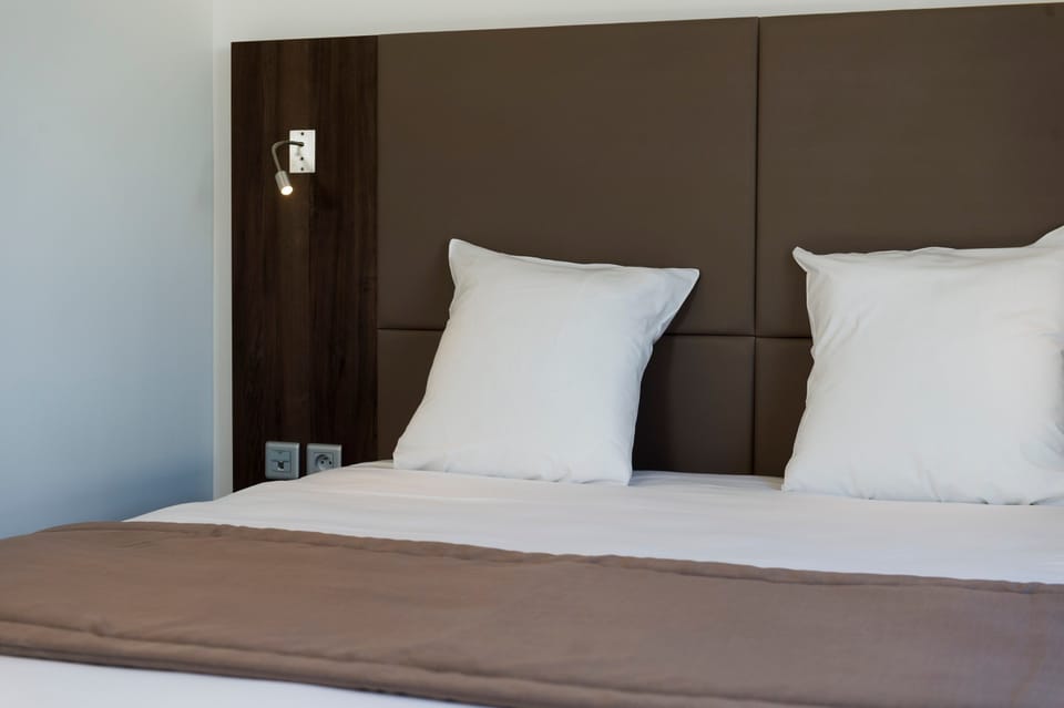 Relax on the comfy bed after a day outside.