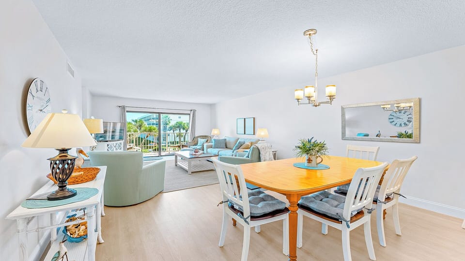 Open-concept dining and living area with a bright atmosphere.