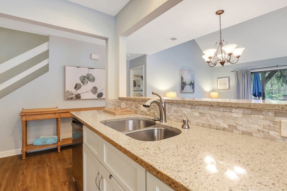 Fully equipped kitchen with stainless steel appliances, ample counter space, and a cozy breakfast nook.