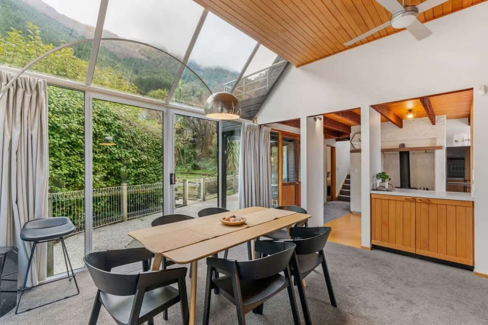 Dining with sliding doors to back yard and garden
