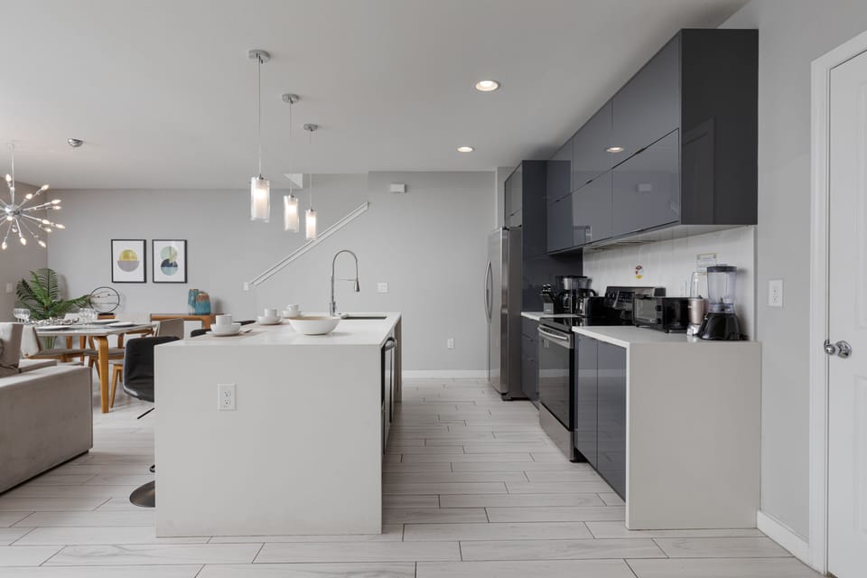 Open Concept Living Space Connecting Kitchen and Dining Area.