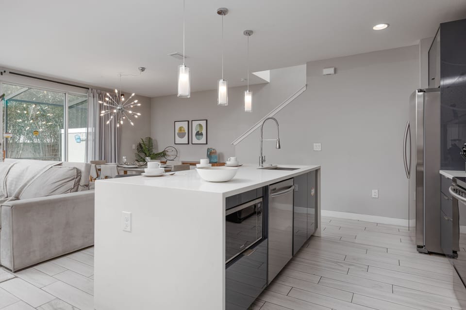 Open Concept Living Space Connecting Kitchen and Dining Area.