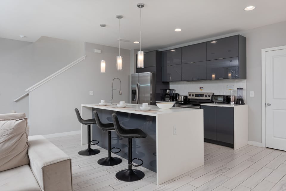 Kitchen Countertop with 3 Stylish Barstools.