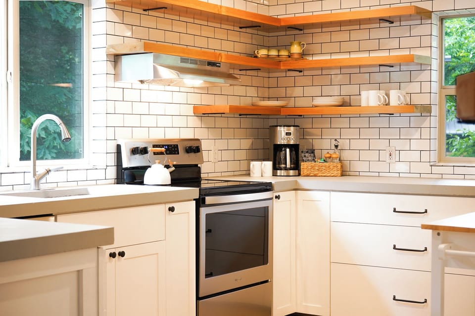 Chefs kitchen with new appliances and coffee bar.