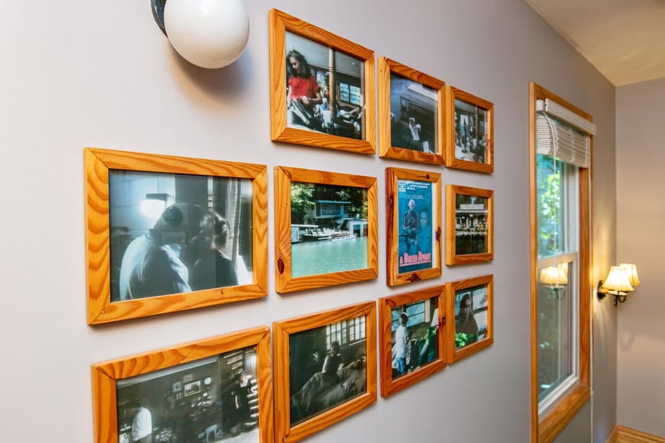 Wall of Fame - Collage of Pictures and Authentic light fixture from the 1984 Hollywood Film, "A Breed Apart" filmed in the house. The movie stars, Kathleen Turner, Rutger Hauer and Powers Booth