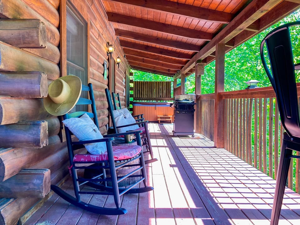 Out on the porch you'll find rocking chairs and a dining table.