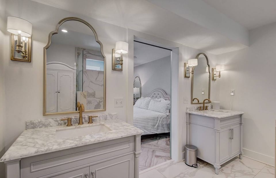 Downstairs king suite, accessible bathroom with double vanity sinks.