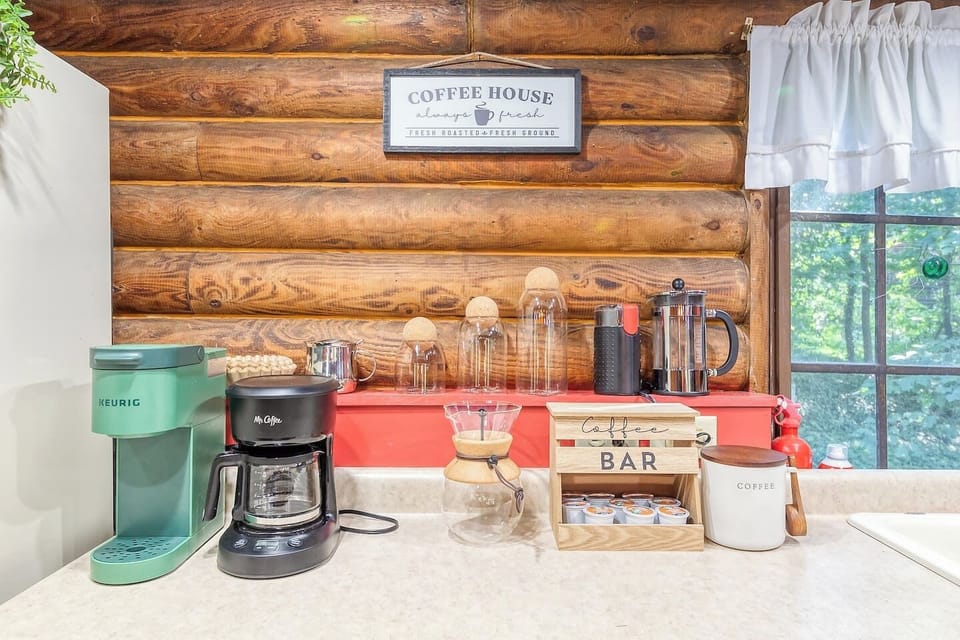 Coffee bar equipped with a coffee grinder, French press, drip coffee, and a Keriug machine. Enjoy!