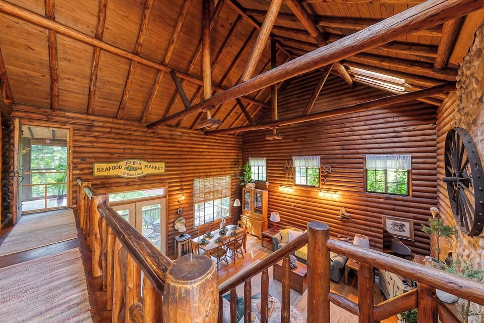 Hallway as you enter the cabin. Leads to screened in porch and full bathroom.