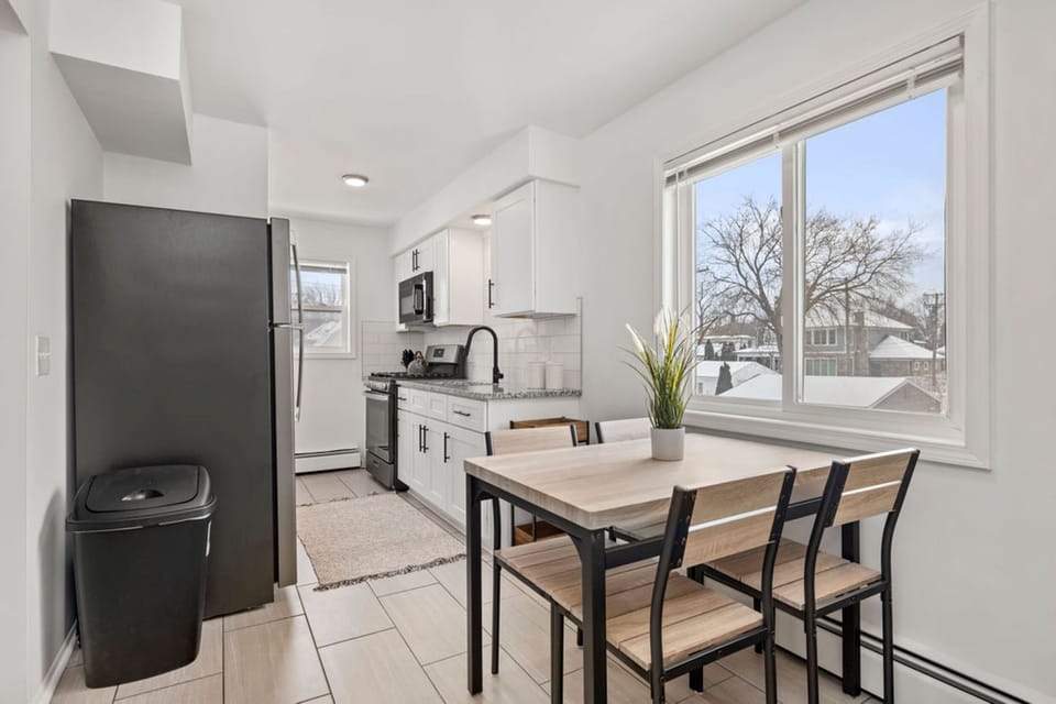 Kitchen opens up into the dining area, featuring tons of natural light