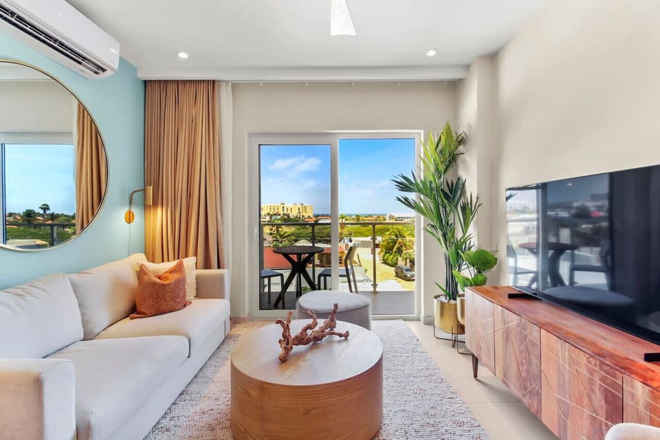 With an open concept modern living room, you can enjoy the blue sunny skies of Aruba from all parts of this condo and Enjoy the  views of the famous Palm beach