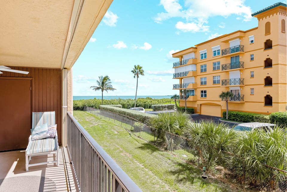 Private balcony with breathtaking ocean and garden views.