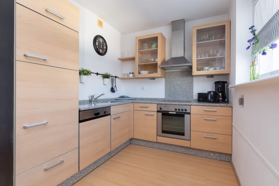 Well-equipped kitchen featuring modern appliances and plenty of counter space for cooking.
