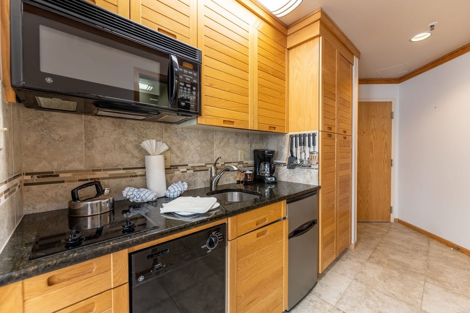 Your fully equipped kitchen features modern appliances and granite countertops, perfect for preparing meals during your stay.