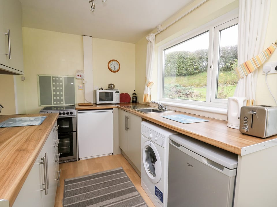Fridge, electric kettle, toaster, cookware/dishes/utensils
