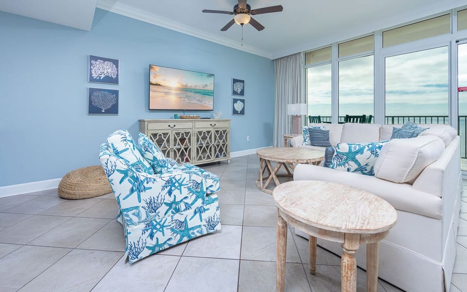 Relax in stylish seating, enjoying coastal views and the tranquil sounds that fill the inviting living space